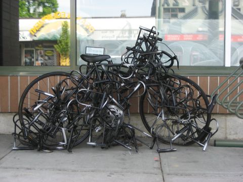 a bike locked-up by dozens of U-locks