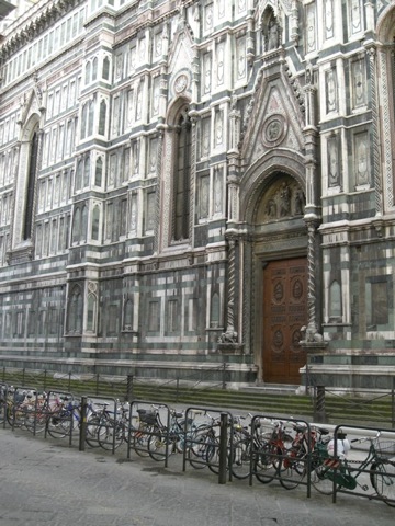 Photos of bikes locked up outside the Florence Duomo